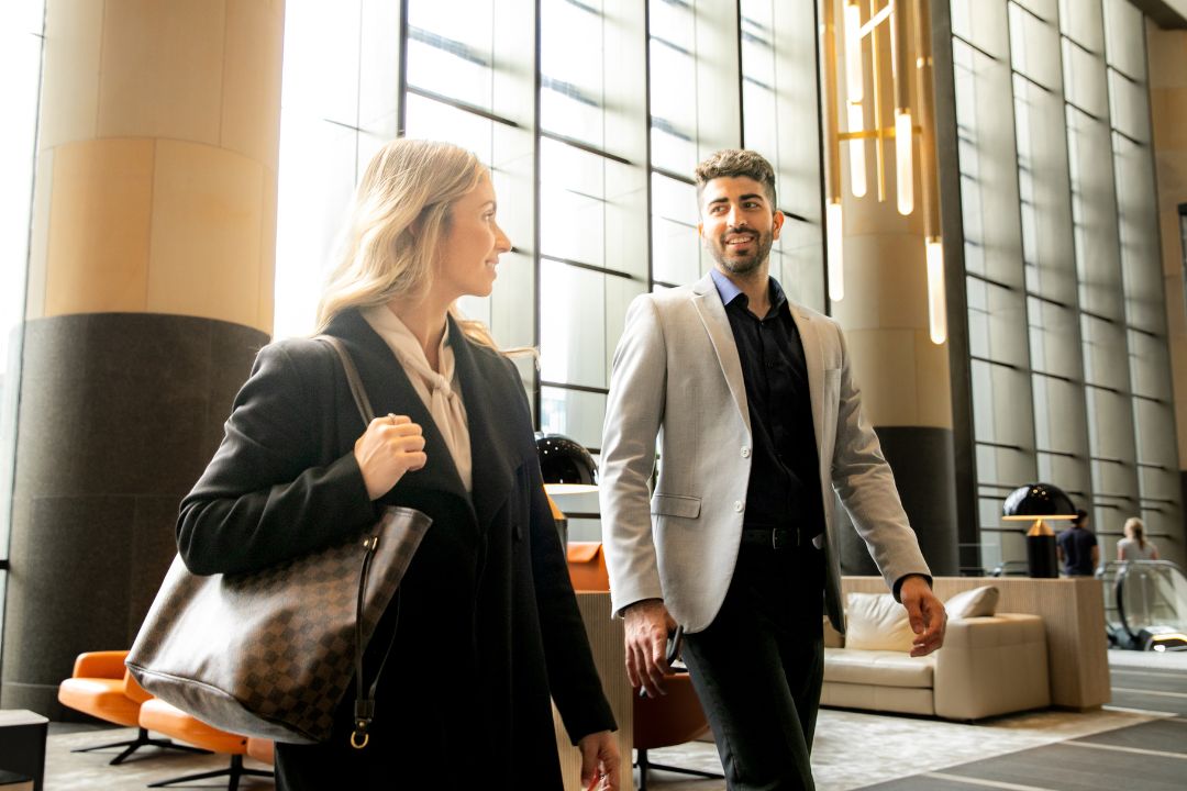 Two people wearing corporate attire